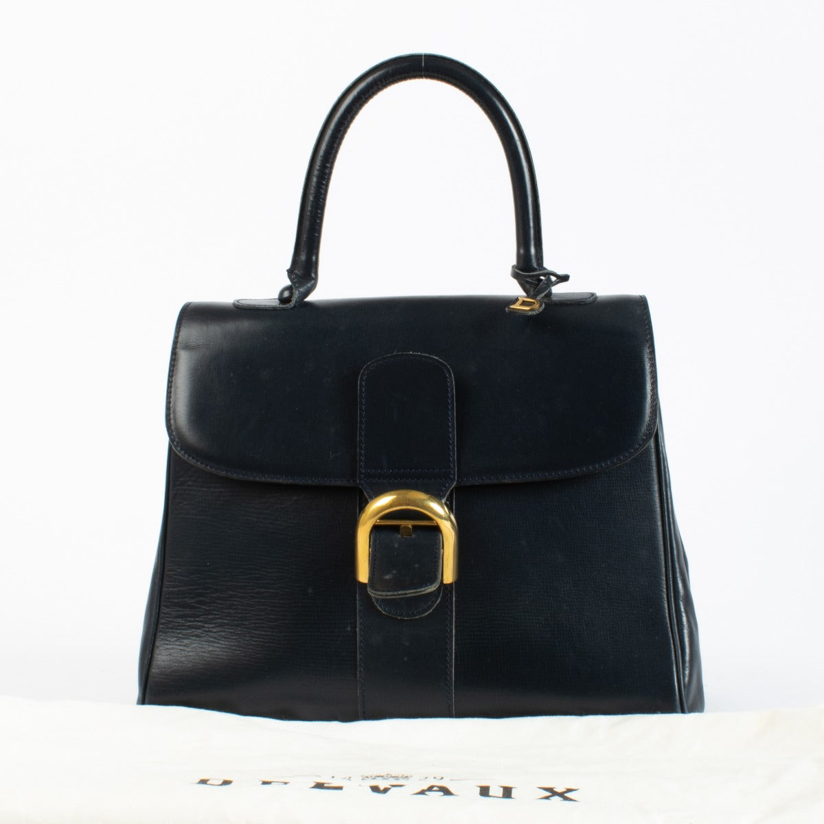 Delvaux 1960s Marine Blue Leather Brillant MM in smooth box leather with gold-tone hardware, available at Labellov.com