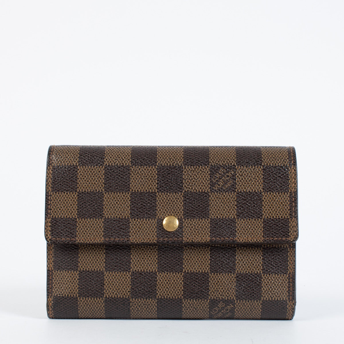 Louis Vuitton Damier Ebene Trésor Wallet in brown checkered canvas with gold-tone snap closure and original dust bag at Labellov.com.