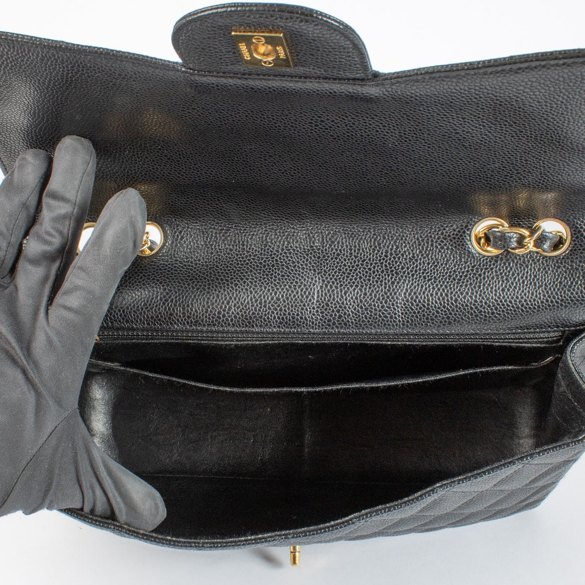 Authentic Chanel Black Caviar Leather Classic Flap Bag with gold hardware at Labellov.com