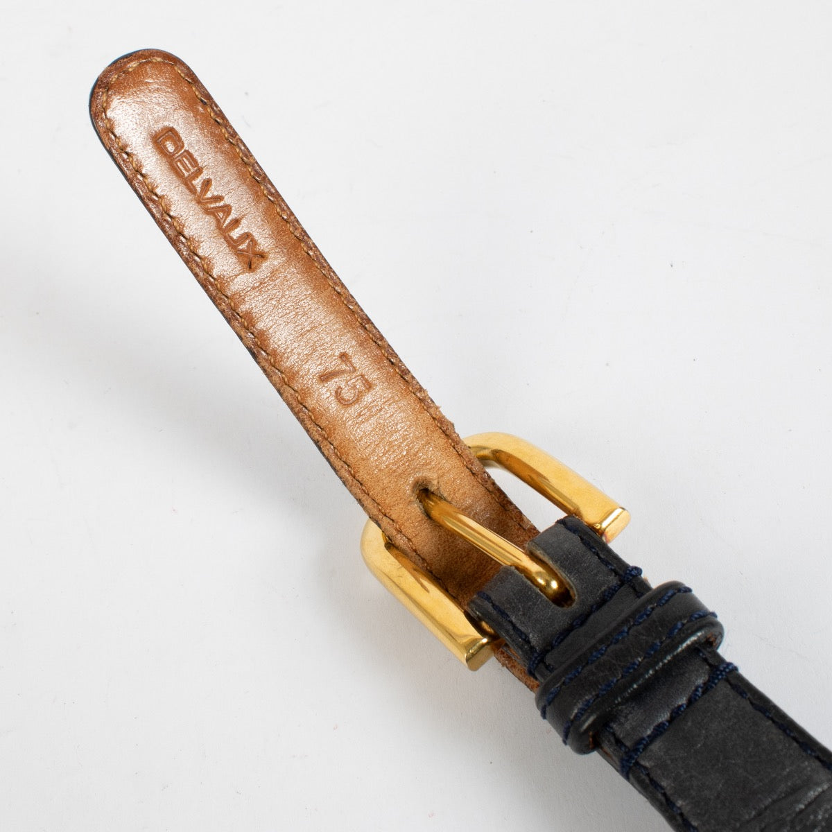 Delvaux Black Leather Belt with gold buckle and signature D cut-out design at Labellov.com