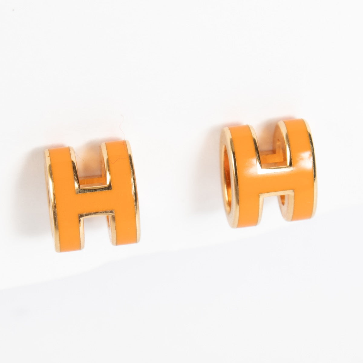 Shop 100% authentic earrings on Labellov.com Hermès Orange Pop H Earrings