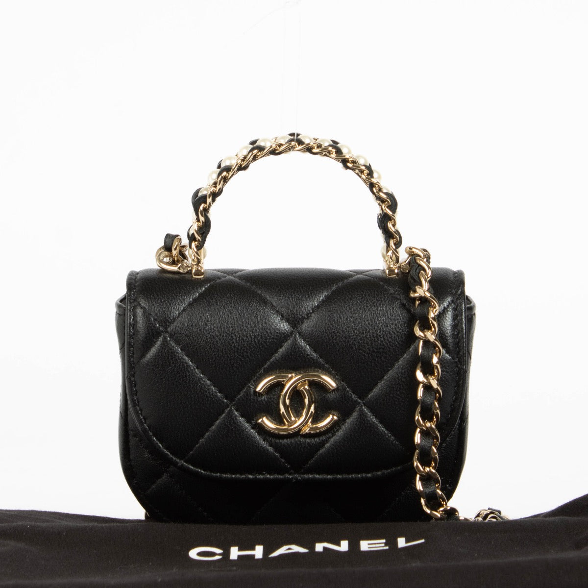 Authentic pre-loved Chanel Black Lambskin Pearl Top Handle Clutch with Chain on Labellov.com