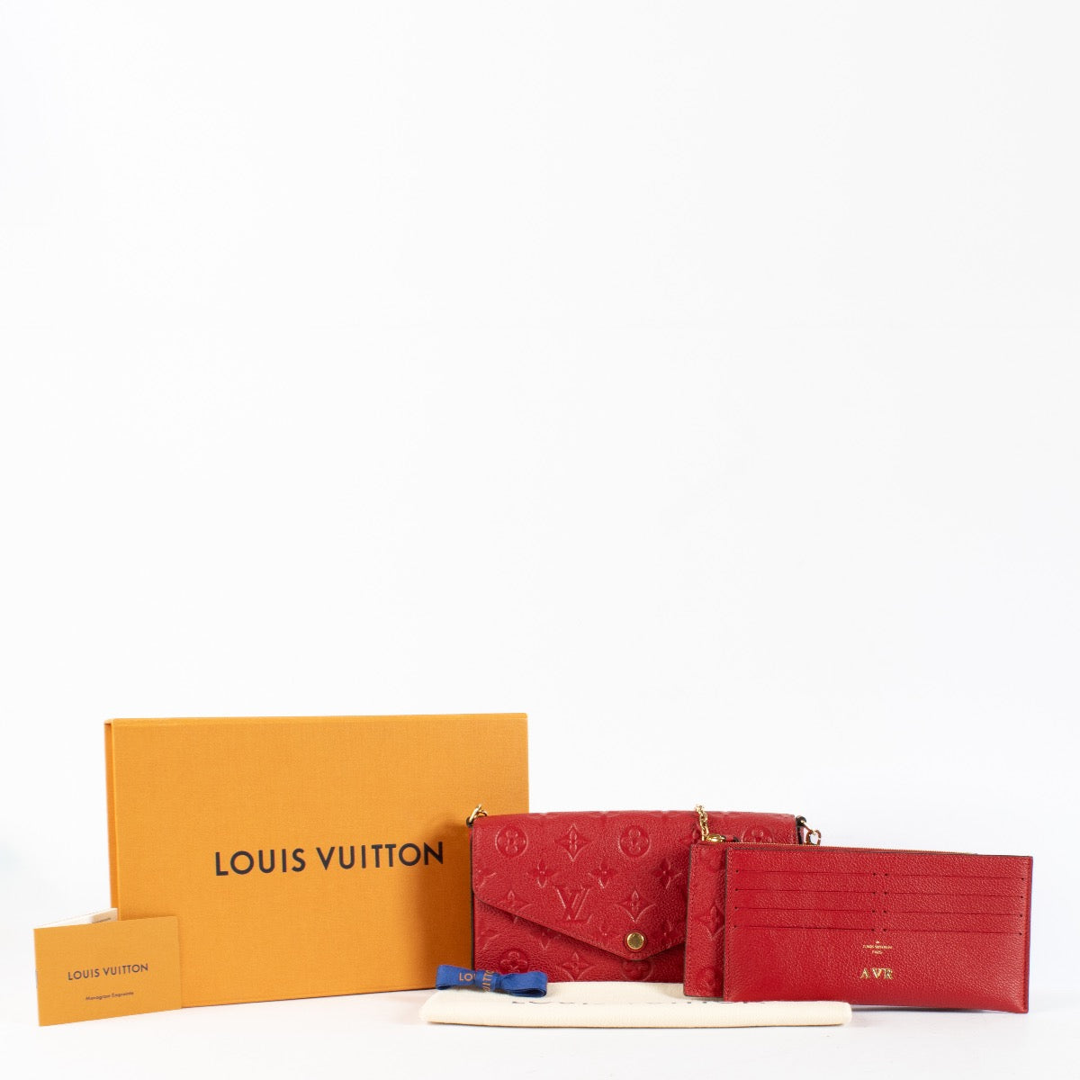 Authentic pre-loved Louis Vuitton Red Monogram Empreinte Pochette Felicie on Labellov.com