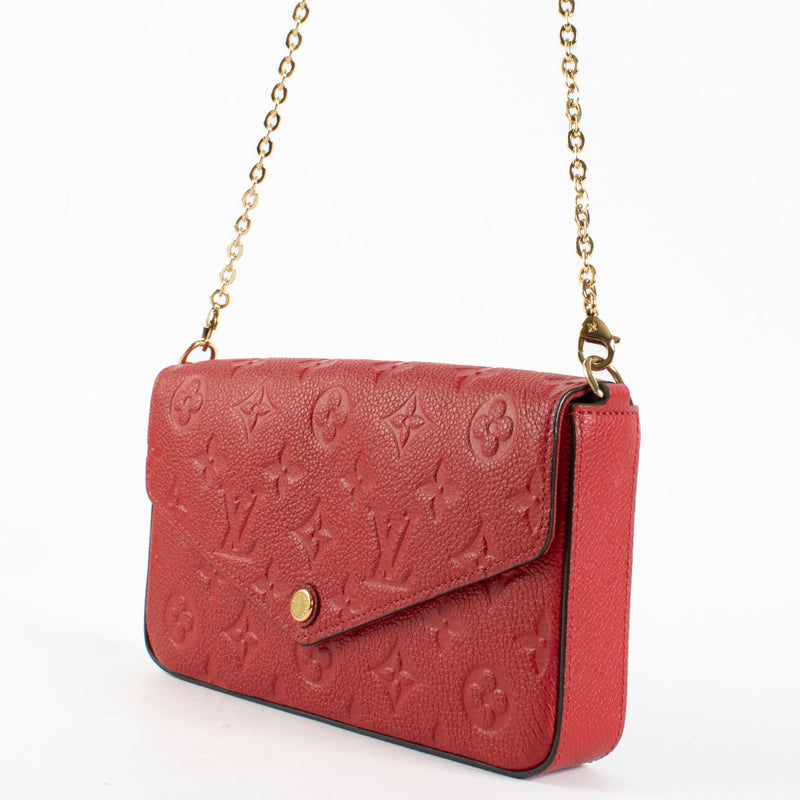 Authentic pre-loved Louis Vuitton Red Monogram Empreinte Pochette Felicie on Labellov.com
