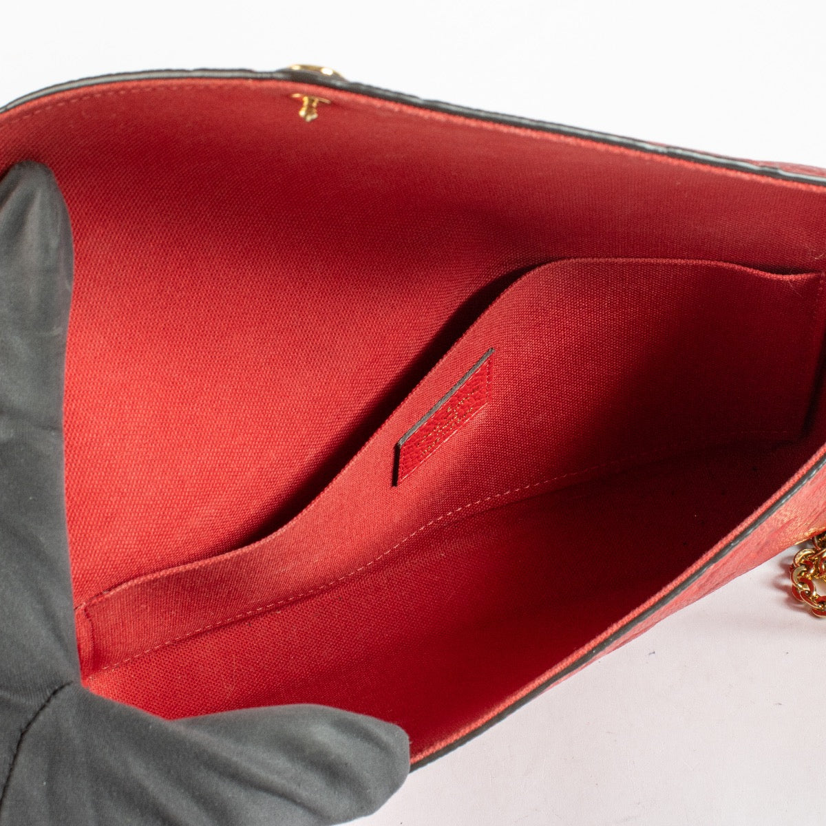 Authentic pre-loved Louis Vuitton Red Monogram Empreinte Pochette Felicie on Labellov.com