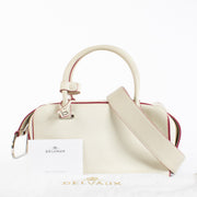 Delvaux White Cool Box MM in smooth white leather with pink edge detailing and silver-tone hardware, in good pre-loved condition, available at Labellov.com