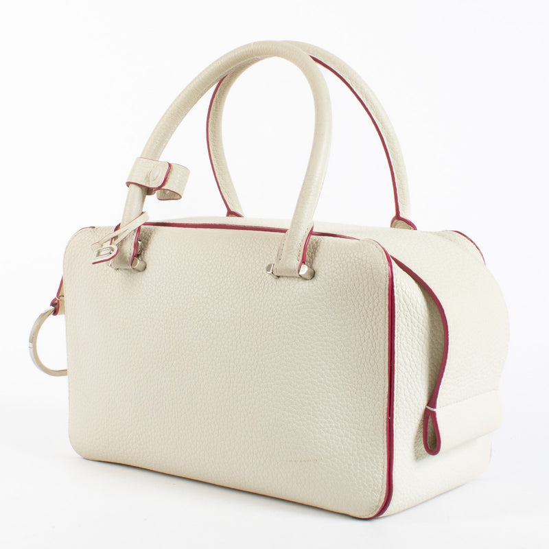 Delvaux White Cool Box MM in smooth white leather with pink edge detailing and silver-tone hardware, in good pre-loved condition, available at Labellov.com