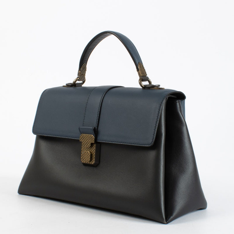 Bottega Veneta Navy Blue Leather Medium Piazza Top Handle Bag with antique gold-tone hardware and woven strap, in very good pre-loved condition, available at Labellov.com