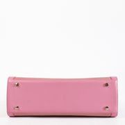 Delvaux Fuchsia Rodéo Calf Brillant MM with gold-tone hardware and beige leather interior showing a dark mark, in very good pre-loved condition, available at Labellov.com