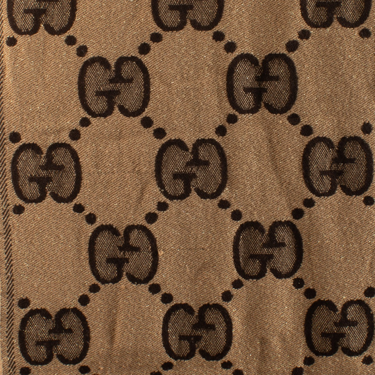 Shop Gucci beige GG lurex wool blend scarf with monogram and gold shimmer. Timeless design and soft texture available now at Labellov.com.