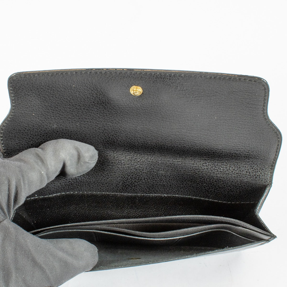 Delvaux black leather wallet with gold-tone logo at Labellov.com