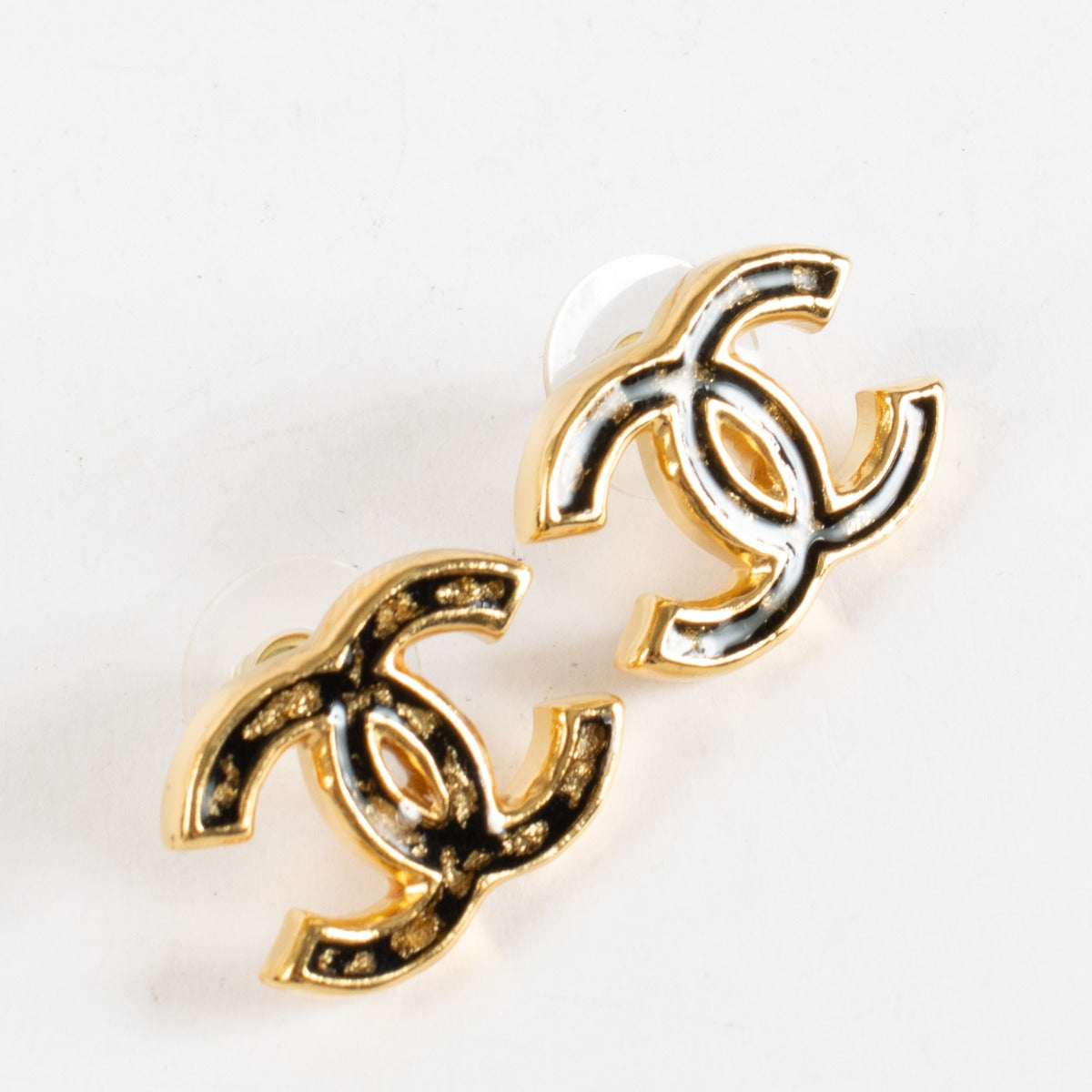 Chanel 23C black and gold CC earrings with gold-fleck enamel detailing at Labellov.com