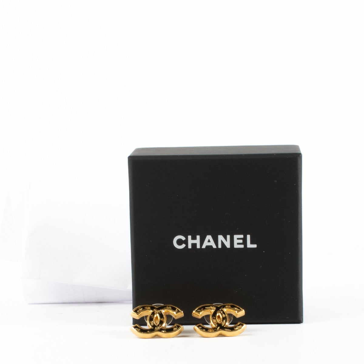 Chanel 23C black and gold CC earrings with gold-fleck enamel detailing at Labellov.com