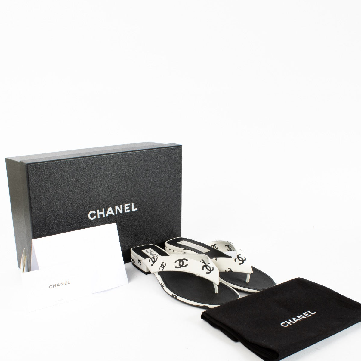 Authentic Preloved Chanel 22S White CC Thong Sandals - size 39 on Labellov.com