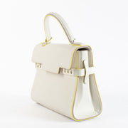 Pre-loved Delvaux Tempête MM Ruban in ivory calfskin with detachable fur strap. A rare, collectible Belgian luxury bag in excellent condition.