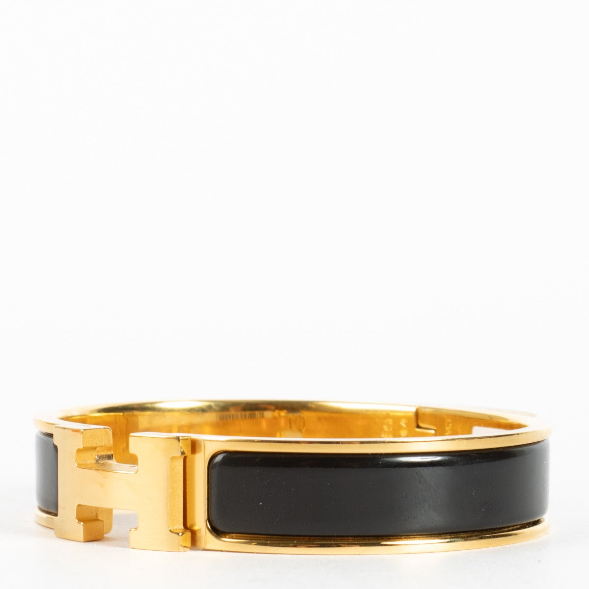 Discover the Hermès Black Enamel Clic H Bracelet with gold hardware at Labellov.com — iconic, elegant and authenticated. Shop luxury accessories online.