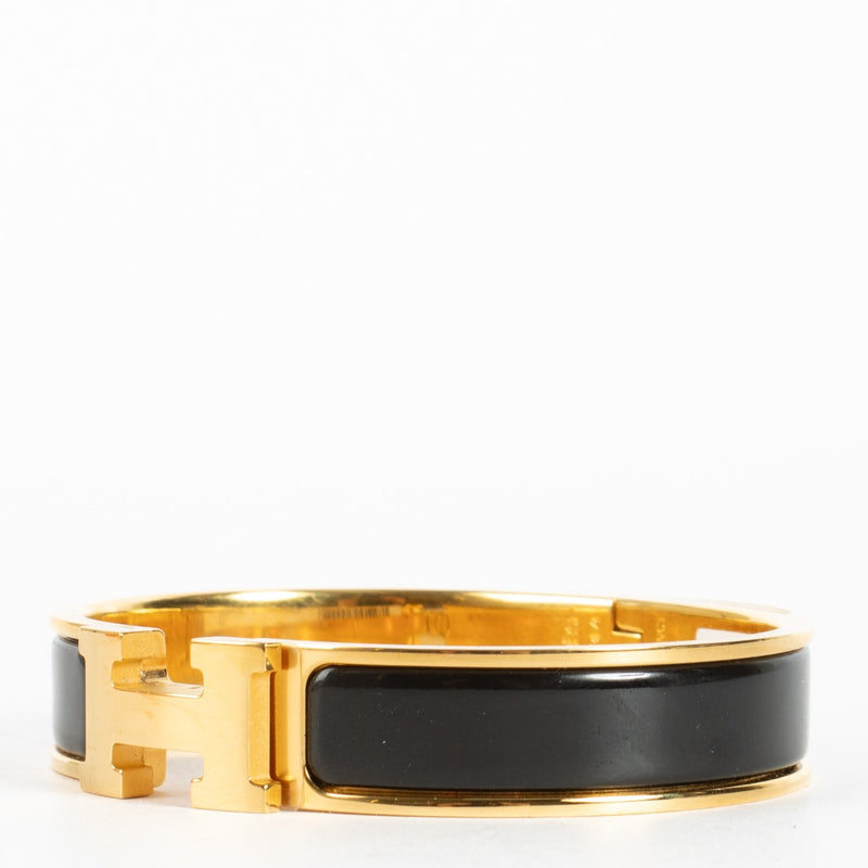Discover the Hermès Black Enamel Clic H Bracelet with gold hardware at Labellov.com — iconic, elegant and authenticated. Shop luxury accessories online.