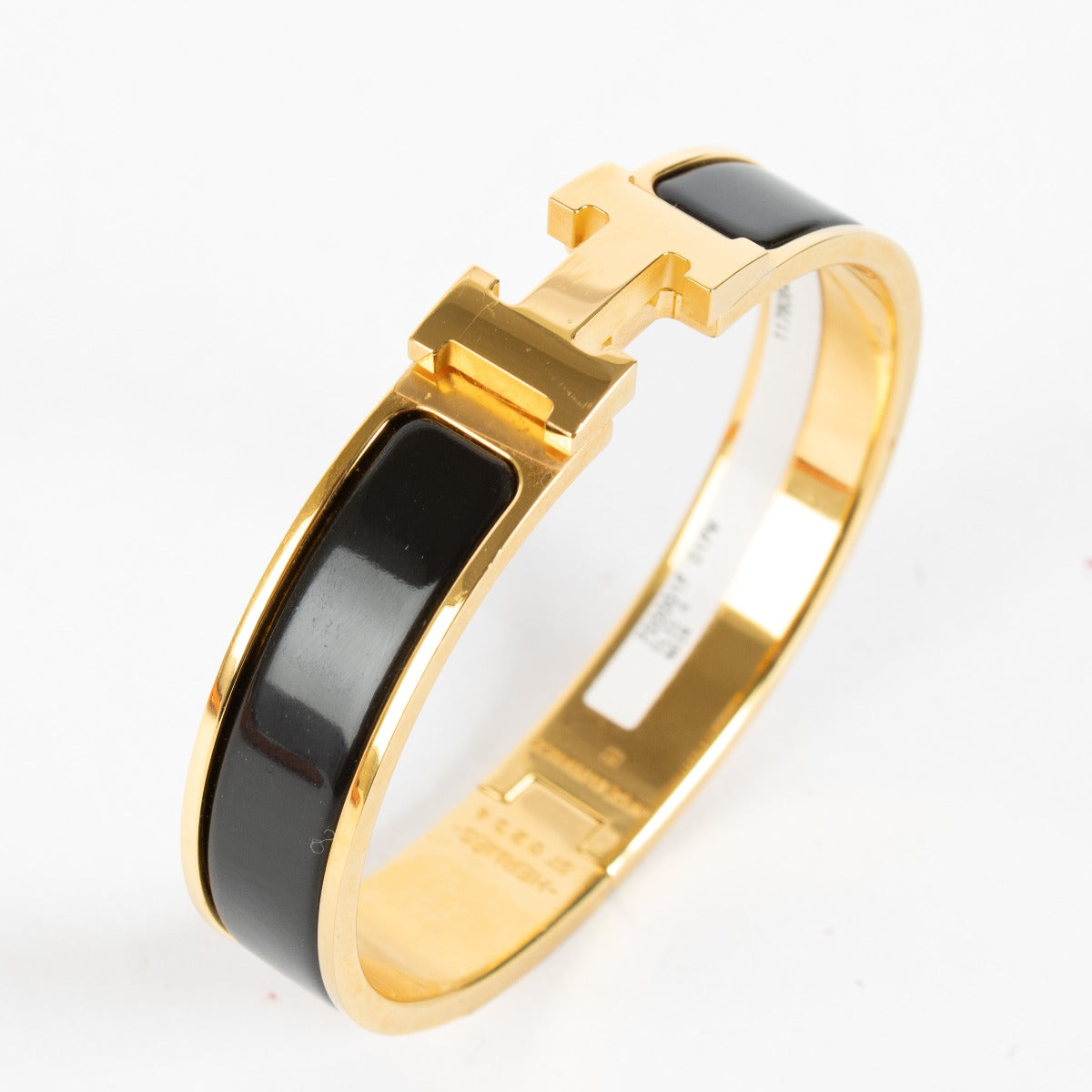 Discover the Hermès Black Enamel Clic H Bracelet with gold hardware at Labellov.com — iconic, elegant and authenticated. Shop luxury accessories online.