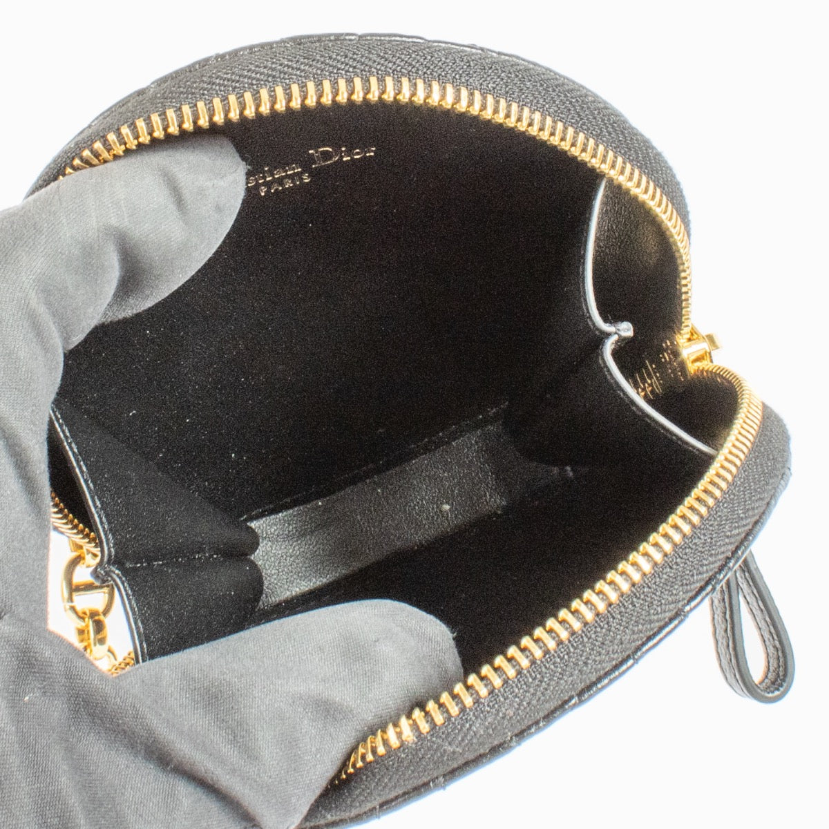 Christian Dior Black Caro Round Pouch Crossbody Bag in quilted black leather with gold CD hardware at Labellov.com