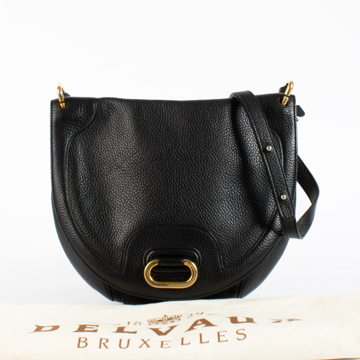 Delvaux black leather crossbody bag with gold hardware and saddle silhouette at Labellov.com