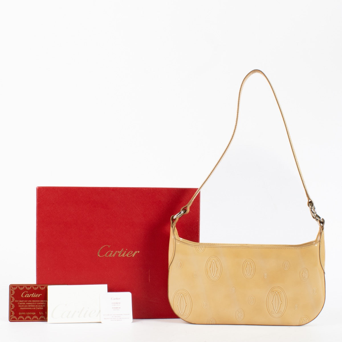 shop 100% authentic second hand Cartier Beige Patent Happy Birthday Pochette Bag on Labellov.com