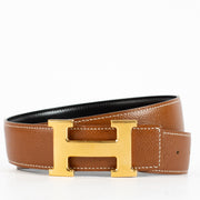 shop 100% authentic second hand Hermès Gold/Black H Buckle Reversible Belt - Size 80 on Labellov.com