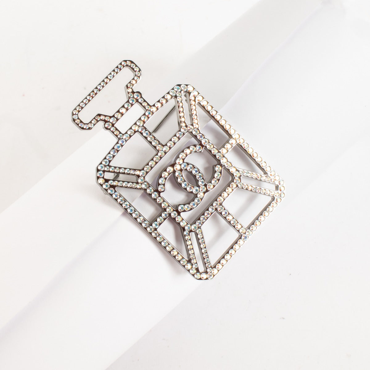 Authentic pre-loved Chanel Crystal Perfume Bottle CC Brooch Ruthenium Iridescent Blue on Labellov.com