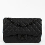 Authentic pre-loved Chanel So Black Aged Cowskin Large / Jumbo Classic Flap Bag on Labellov.com