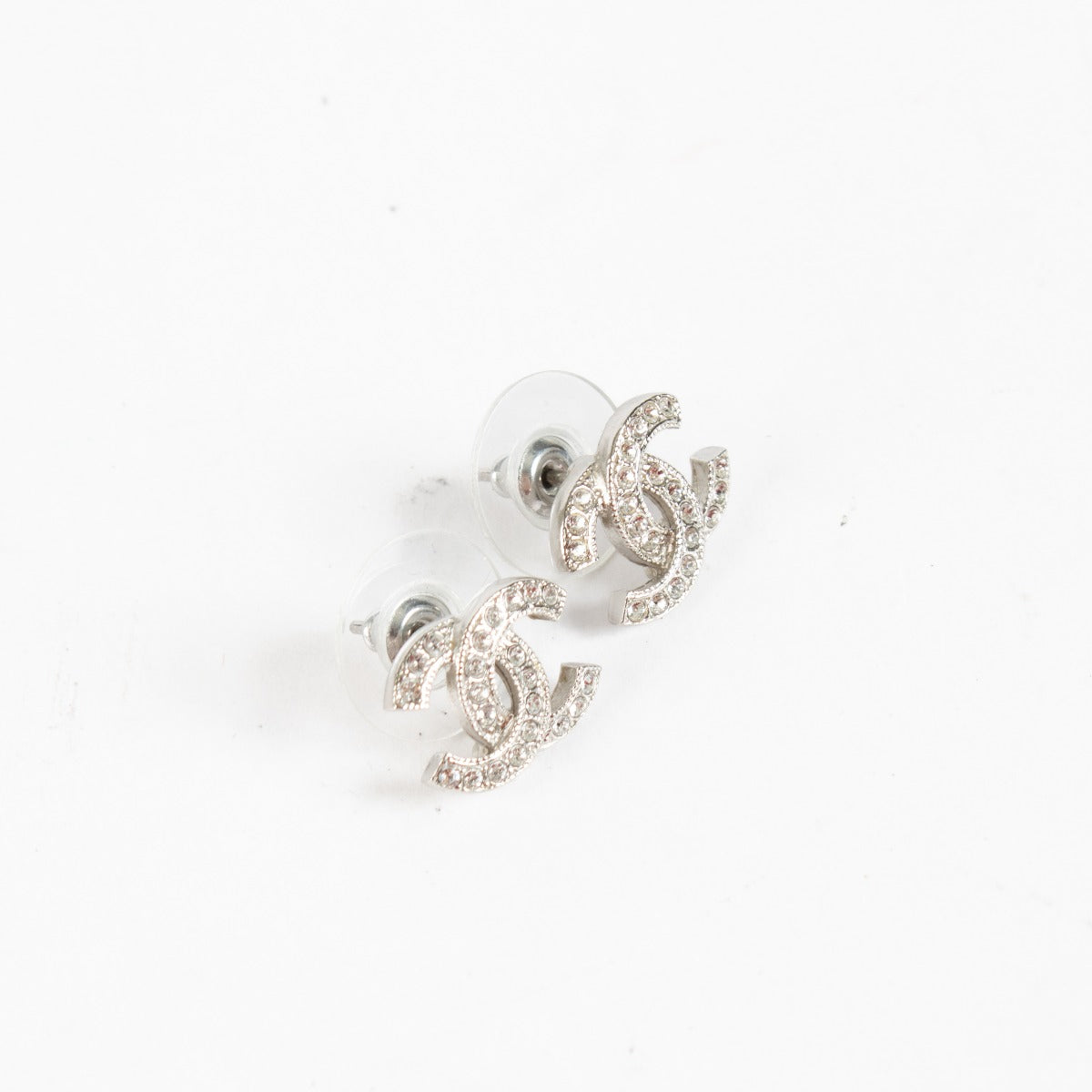 Authentic pre-loved Chanel Metal Quilted CC White Gold Earrings on Labellov.com