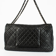 Authentic pre-loved Chanel Black Cowskin XXL Airlines Travel Flap Bag on Labellov.com