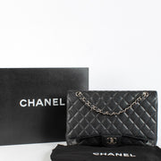 authentic preloved Chanel Maxi Classic Flap Black Caviar SHW on Labellov.com