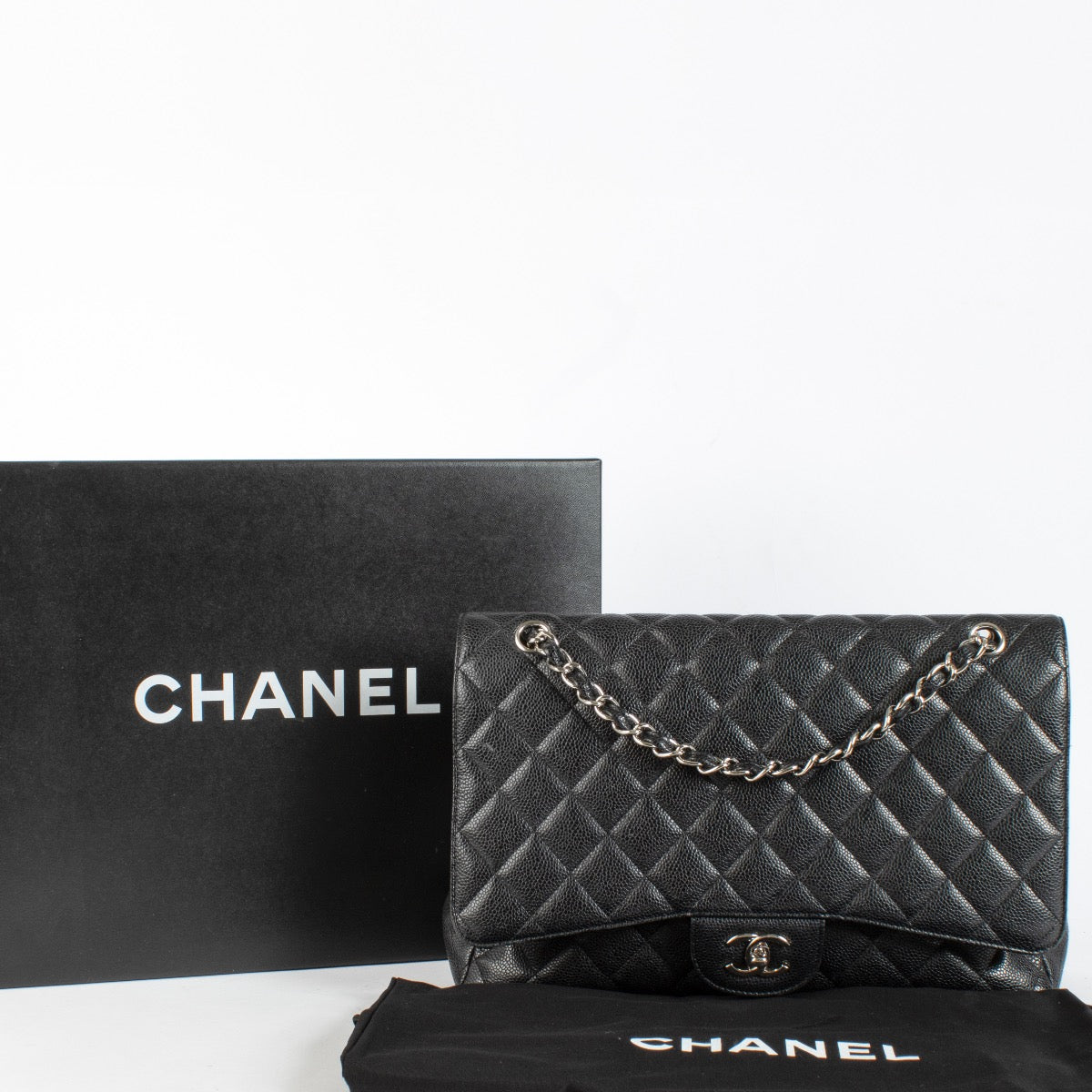 authentic preloved Chanel Maxi Classic Flap Black Caviar SHW on Labellov.com