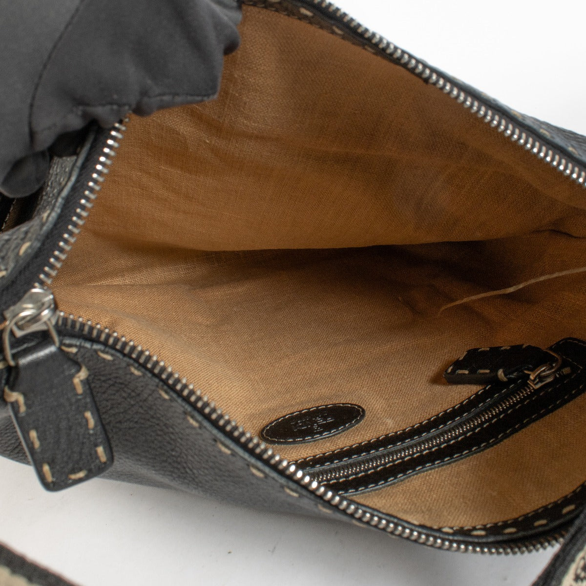 Fendi Black Selleria crossbody bag in grained leather with stitched details and fabric strap at Labellov.com