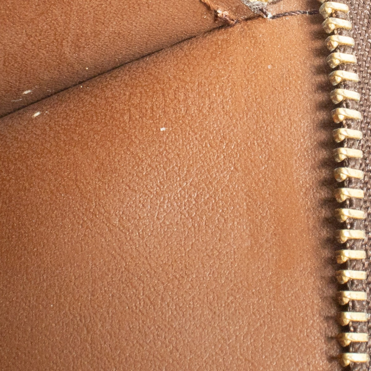 Louis Vuitton Monogram Toiletry Pouch in brown coated canvas with leather trim at Labellov.com