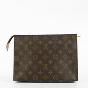 Louis Vuitton Monogram Toiletry Pouch in brown coated canvas with leather trim at Labellov.com