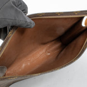 Louis Vuitton Monogram Toiletry Pouch in brown coated canvas with leather trim at Labellov.com