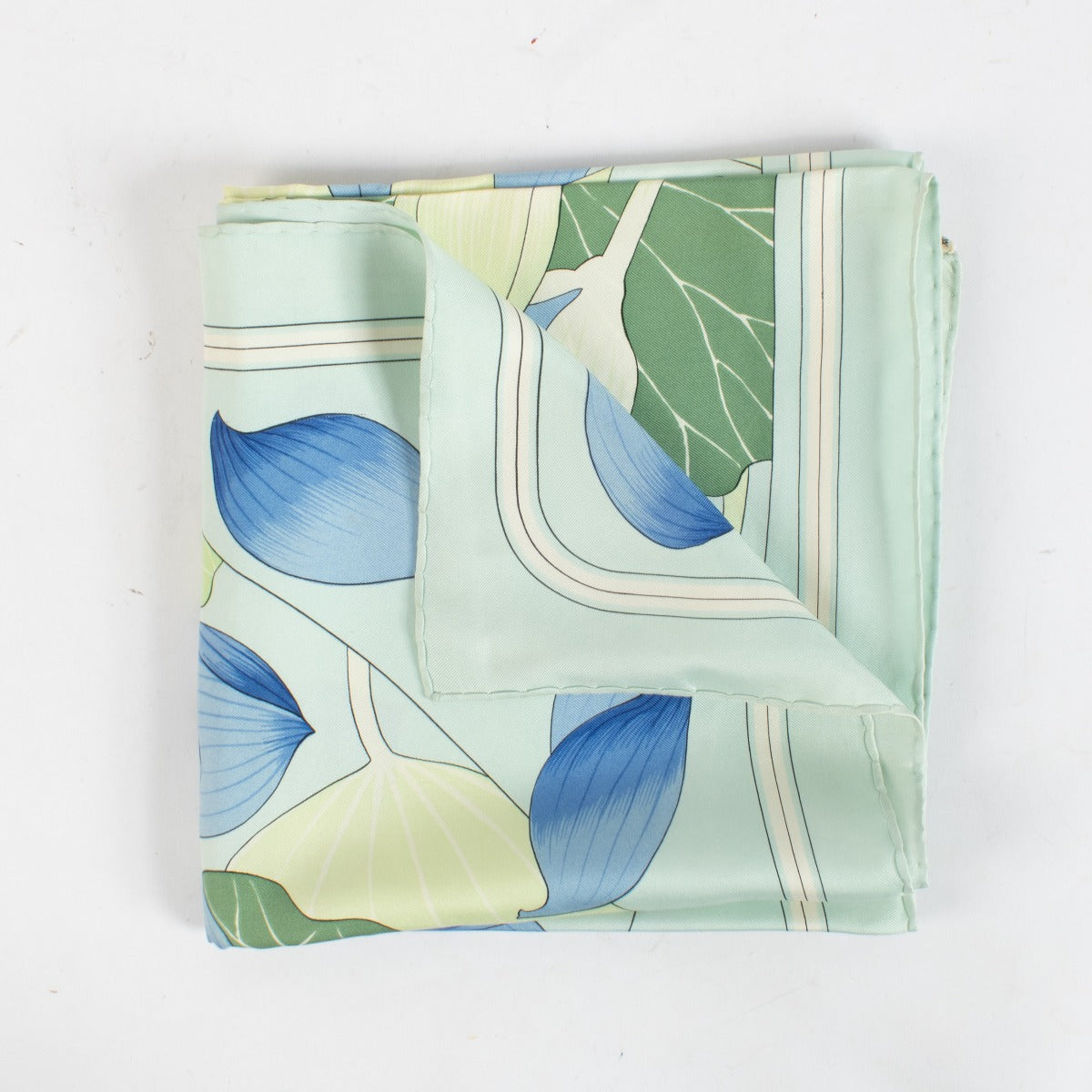 Are you looking for an authentic designer accessory? We buy and sell your preloved and brand new Hermès Blue Fleurs De Lotus 90 Scarf.