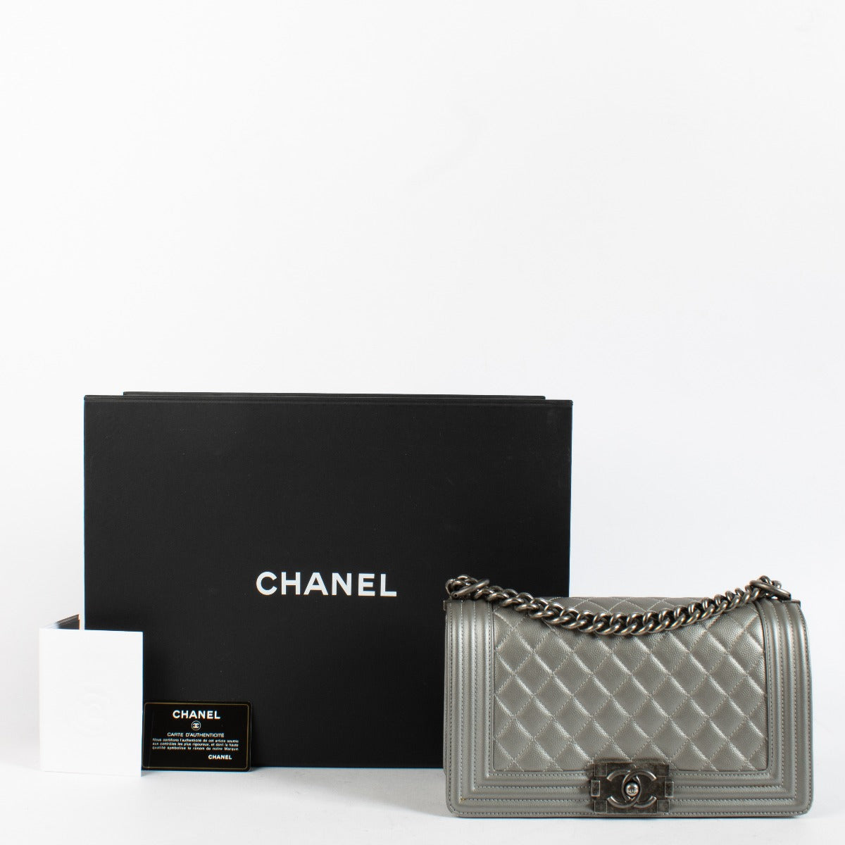 Chanel Silver Medium Boy Bag with quilted leather and aged hardware at Labellov.com