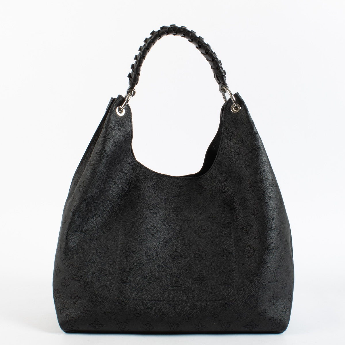 Louis Vuitton Carmel Hobo in black Mahina perforated calf leather with braided handle, silver-tone hardware and roomy interior. Shop now at Labellov.com