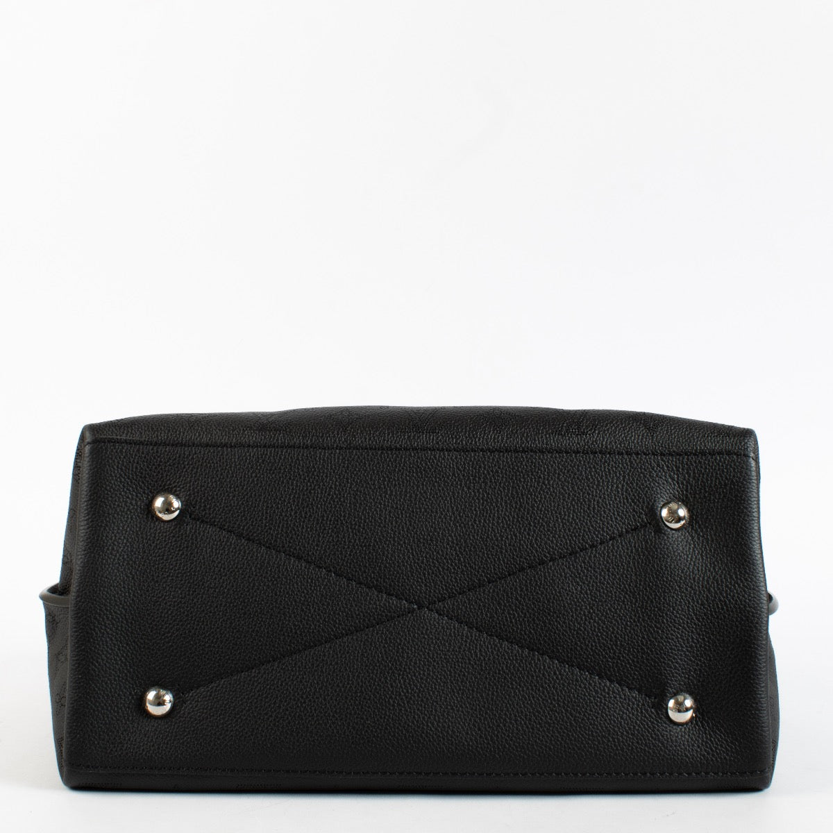 Louis Vuitton Carmel Hobo in black Mahina perforated calf leather with braided handle, silver-tone hardware and roomy interior. Shop now at Labellov.com