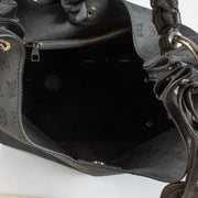 Louis Vuitton Carmel Hobo in black Mahina perforated calf leather with braided handle, silver-tone hardware and roomy interior. Shop now at Labellov.com