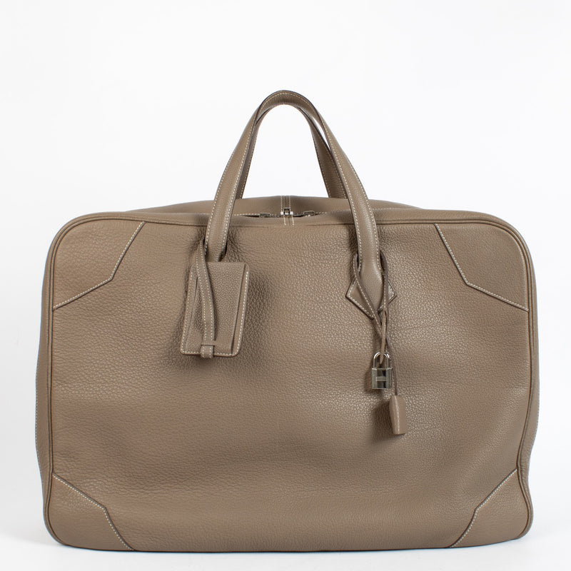 Shop the authentic Hermès Etoupe Clemence PHW Victoria 50 Travel Bag second hand on Labellov.com.