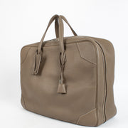 Shop the authentic Hermès Etoupe Clemence PHW Victoria 50 Travel Bag second hand on Labellov.com.