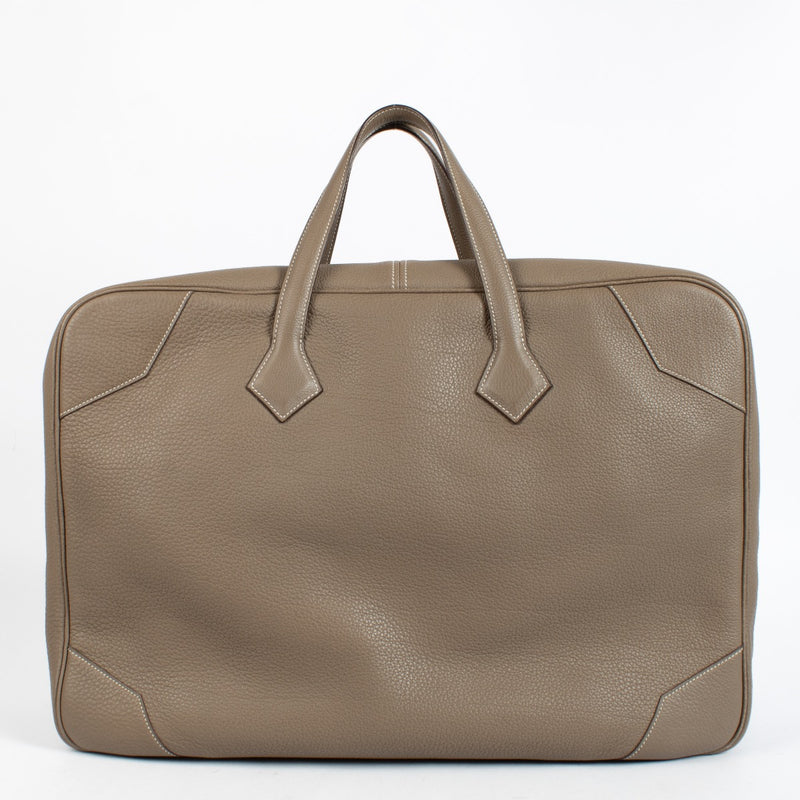 Shop the authentic Hermès Etoupe Clemence PHW Victoria 50 Travel Bag second hand on Labellov.com.
