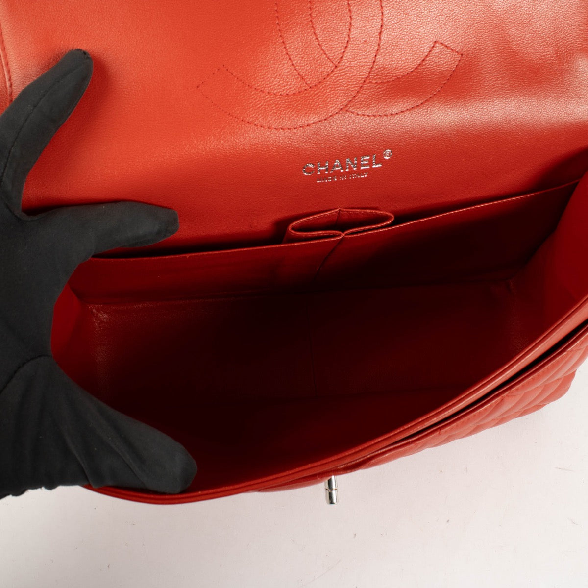 Shop the authentic Chanel Red Lambskin Large / Jumbo Classic Flap Bag second hand on Labellov.com.