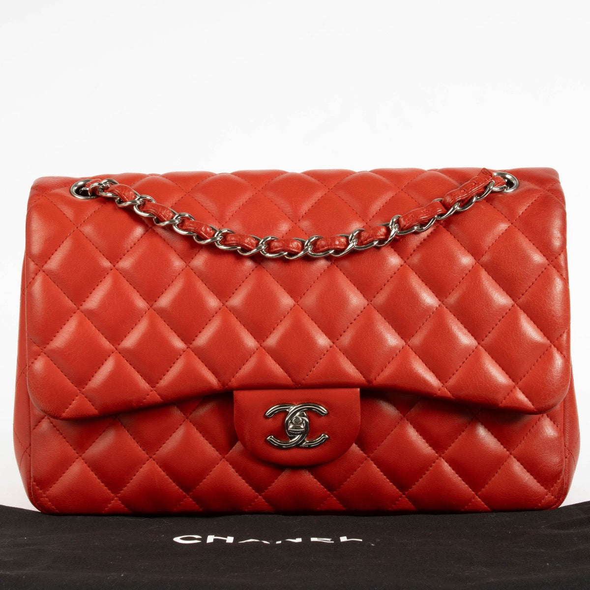 Shop the authentic Chanel Red Lambskin Large / Jumbo Classic Flap Bag second hand on Labellov.com.
