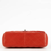 Shop the authentic Chanel Red Lambskin Large / Jumbo Classic Flap Bag second hand on Labellov.com.