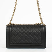 Authentic pre-loved Chanel Black Lambskin Medium Boy Shoulder Bag on Labellov.com