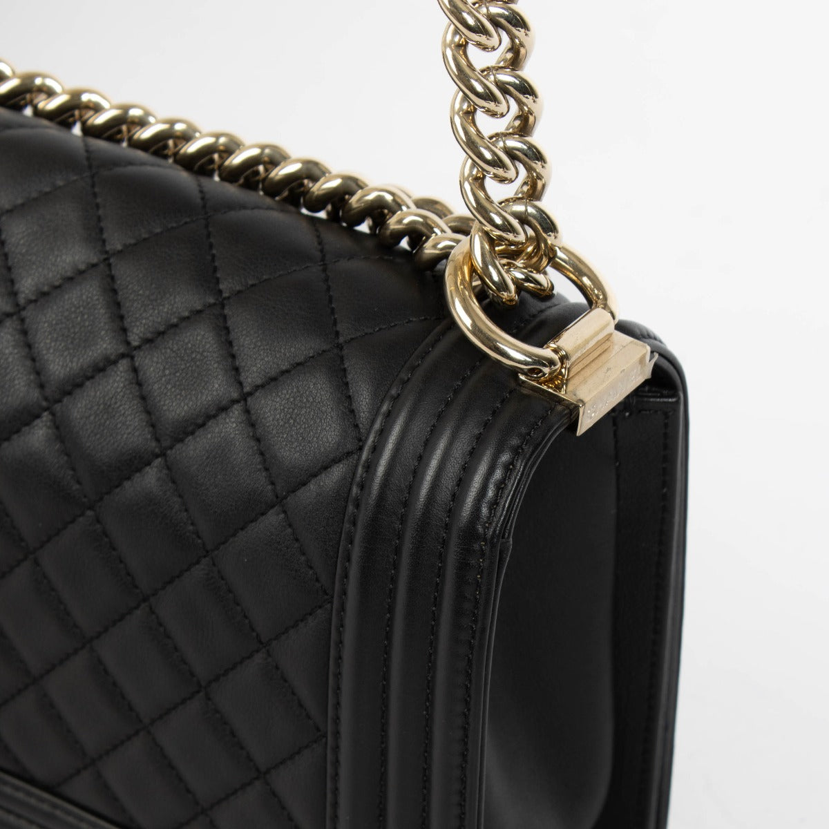 Authentic pre-loved Chanel Black Lambskin Medium Boy Shoulder Bag on Labellov.com