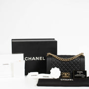 Authentic pre-loved Chanel Black Lambskin Medium Boy Shoulder Bag on Labellov.com